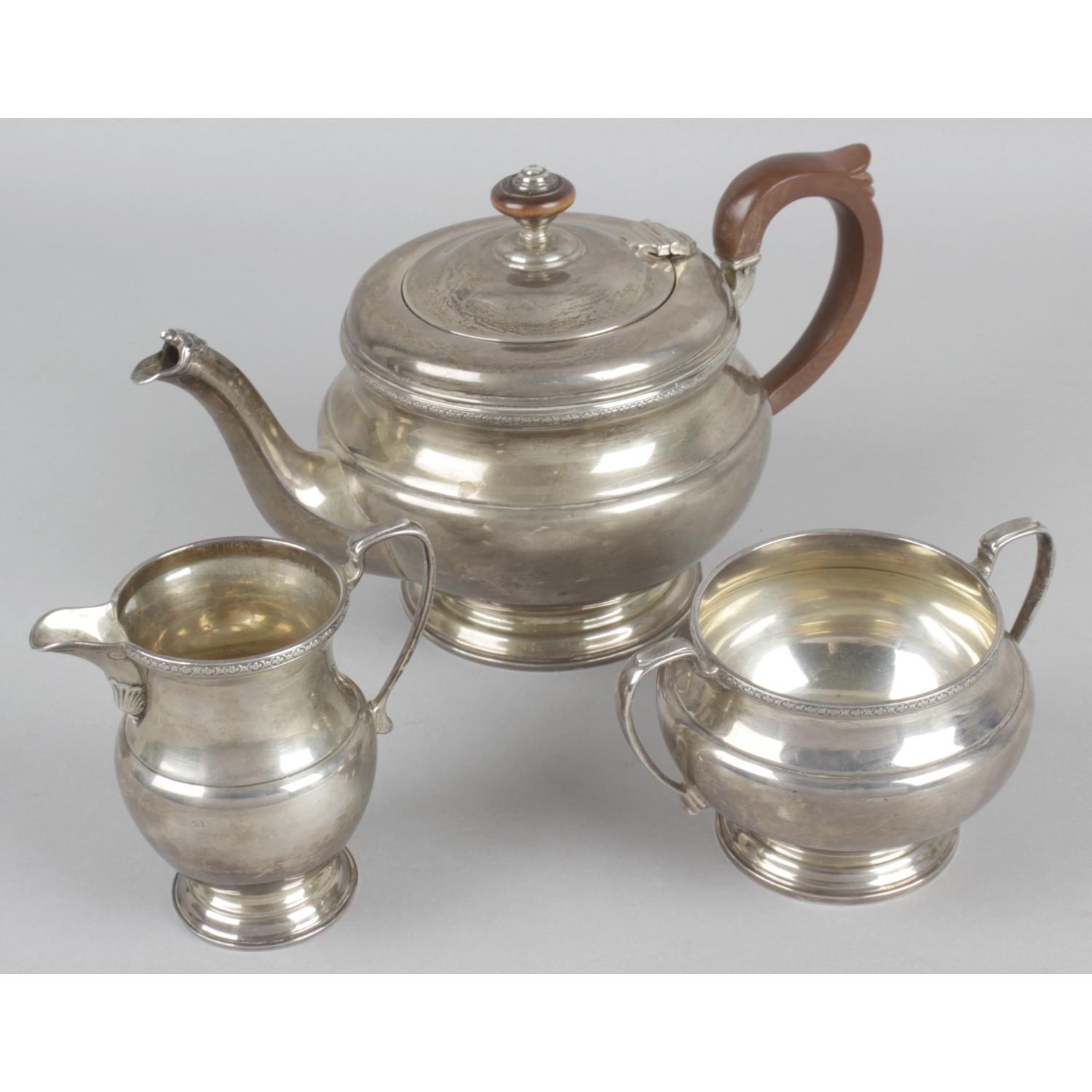 A 1930s silver three piece bachelor tea service,