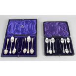 Four cased sets of cutlery to include two cased sets of tea spoons with sugar nips,