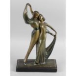 A painted plaster figure modelled as a dancing Art Deco couple, height 13.75 (35cm).