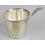 A small measuring cup,