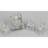 An early 20th century silver miniature toy modelled as a chair with cushion style back and seat,