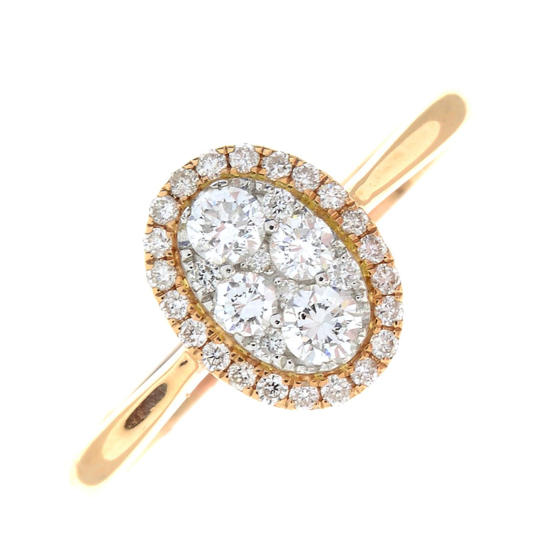 An 18ct gold diamond cluster ring.Estimated total diamond weight 0.40ct.