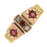 A late 19th century gold garnet and split pearl bi-colour dress ring.Ring size P.