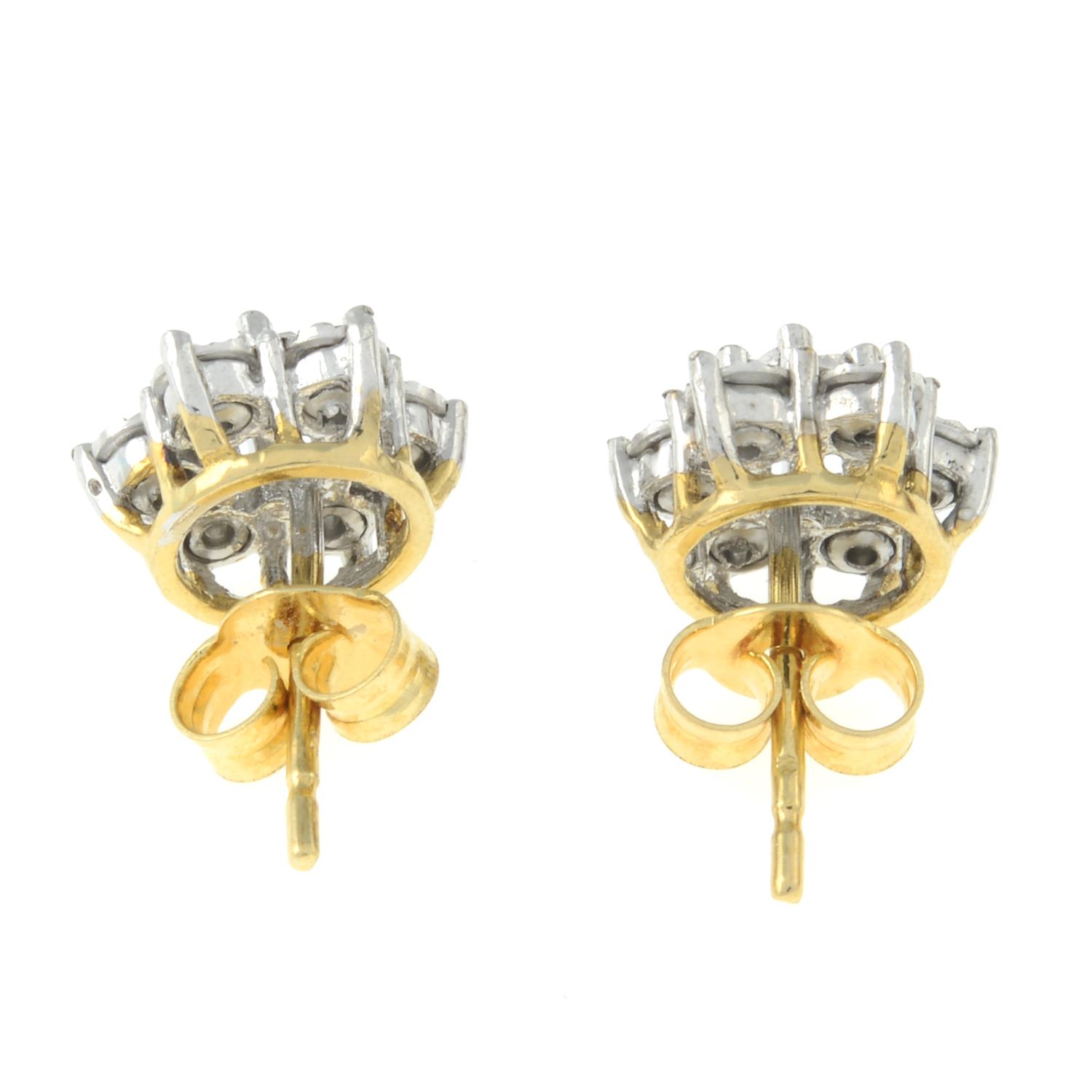 A pair of diamond cluster earrings.Estimated total diamond weight 0.15ct. - Image 2 of 2