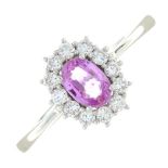 An 18ct gold pink sapphire and diamond cluster ring.Sapphire weight 0.53ct.