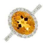 An 18ct gold citrine and diamond cluster ring.Citrine weight 2.45cts.