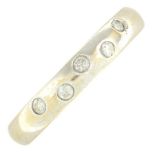 An 18ct gold diamond band ring.Total diamond weight 0.10ct,