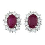 A pair of 18ct gold ruby and diamond cluster stud earrings.Estimated total diamond weight 0.50ct.