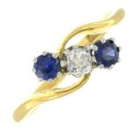 A sapphire and diamond three-stone ring.Estimated diamond weight 0.15ct, H-I colour, P1 clarity.