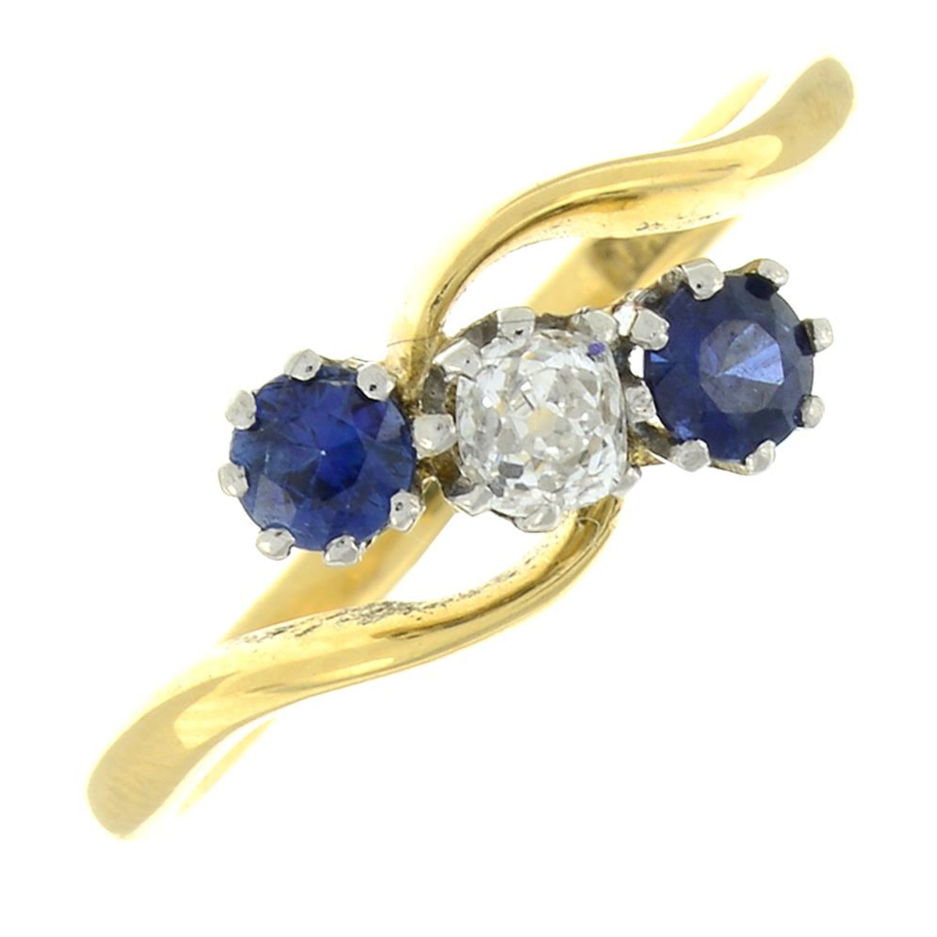 A sapphire and diamond three-stone ring.Estimated diamond weight 0.15ct, H-I colour, P1 clarity.