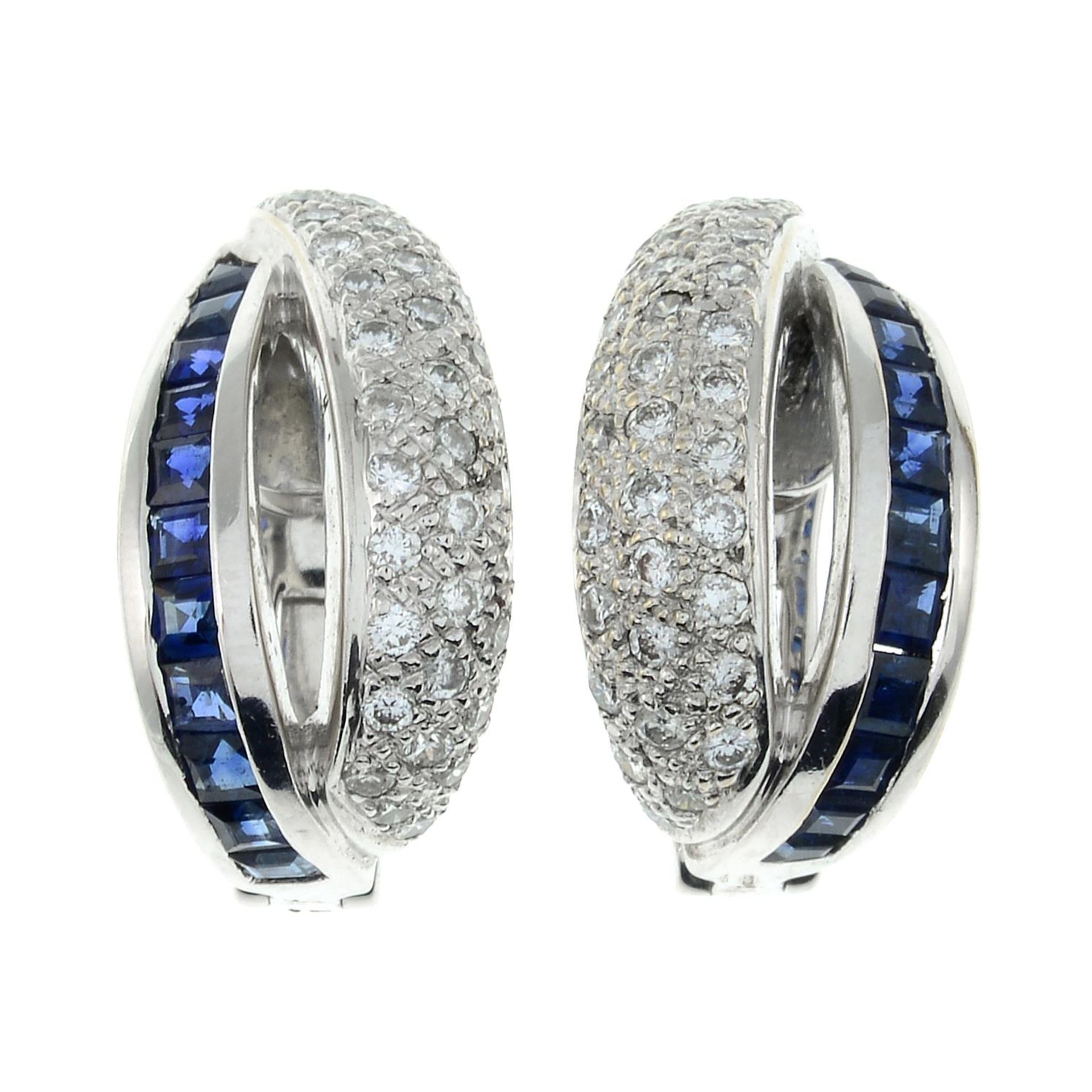 A pair of calibre-cut sapphire and pave-set diamond earrings.Estimated total diamond weight 0.30ct.