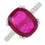 A synthetic ruby and diamond ring.Estimated total diamond weight 0.50ct.