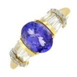 A tanzanite and colouress gem ring.Stamped 585.Ring size R.