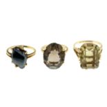 Two 9ct gold smoky quartz single-stone ring,