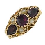 A late 19th century gold garnet and split pearl ring.Hallmarks for Birmingham.