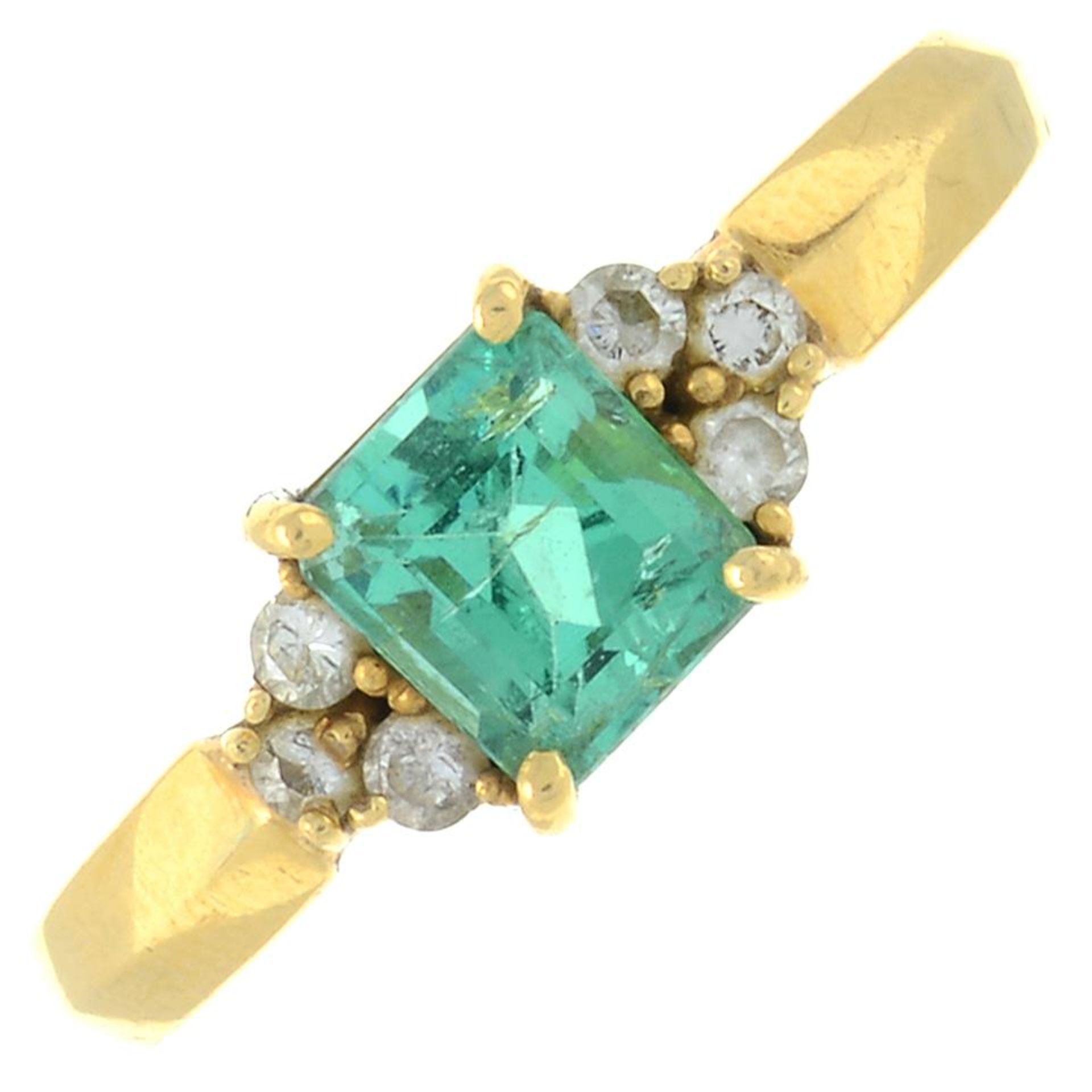 An emerald and diamond ring.Emerald calculated weight 1.02cts,