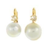 A pair of diamond and split pearl earrings.Length 1.8cms.