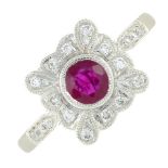 A ruby and diamond dress ring.Ruby weight 0.60ct, total diamond weight 0.15ct, stamped to band.