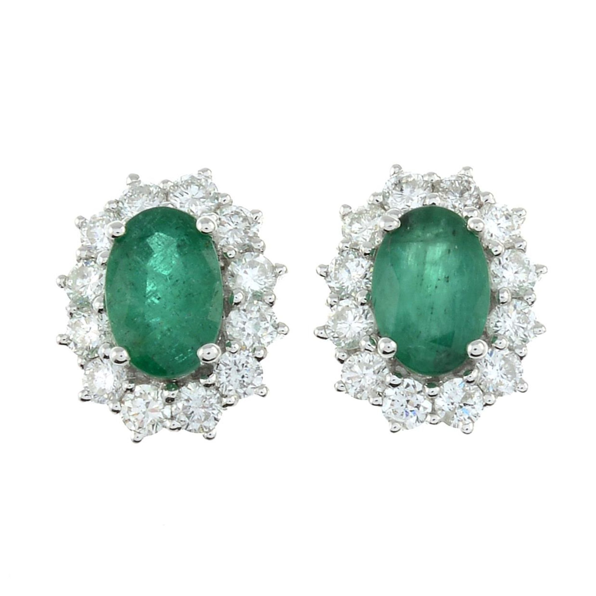 A pair of 18ct gold emerald and diamond cluster stud earrings.Estimated total diamond weight