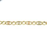 A 9ct gold bracelet, with tri-colour bead spacers.Hallmarks for 9ct gold.