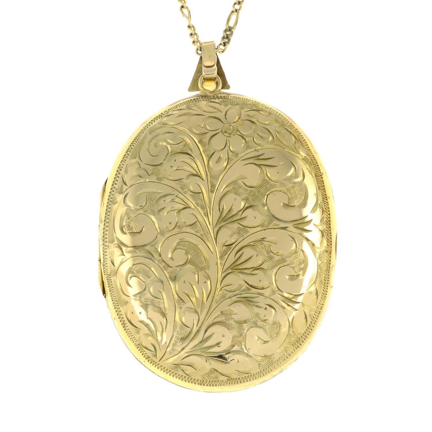 A 9ct gold foliate engraved oval locket pendant,