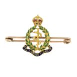 A mid 20th century gold and enamel 'Royal Army Medical Crops' brooch.Length 4.6cms.