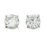 A pair of 18ct gold diamond stud earrings.Estimated total diamond weight 0.50ct,