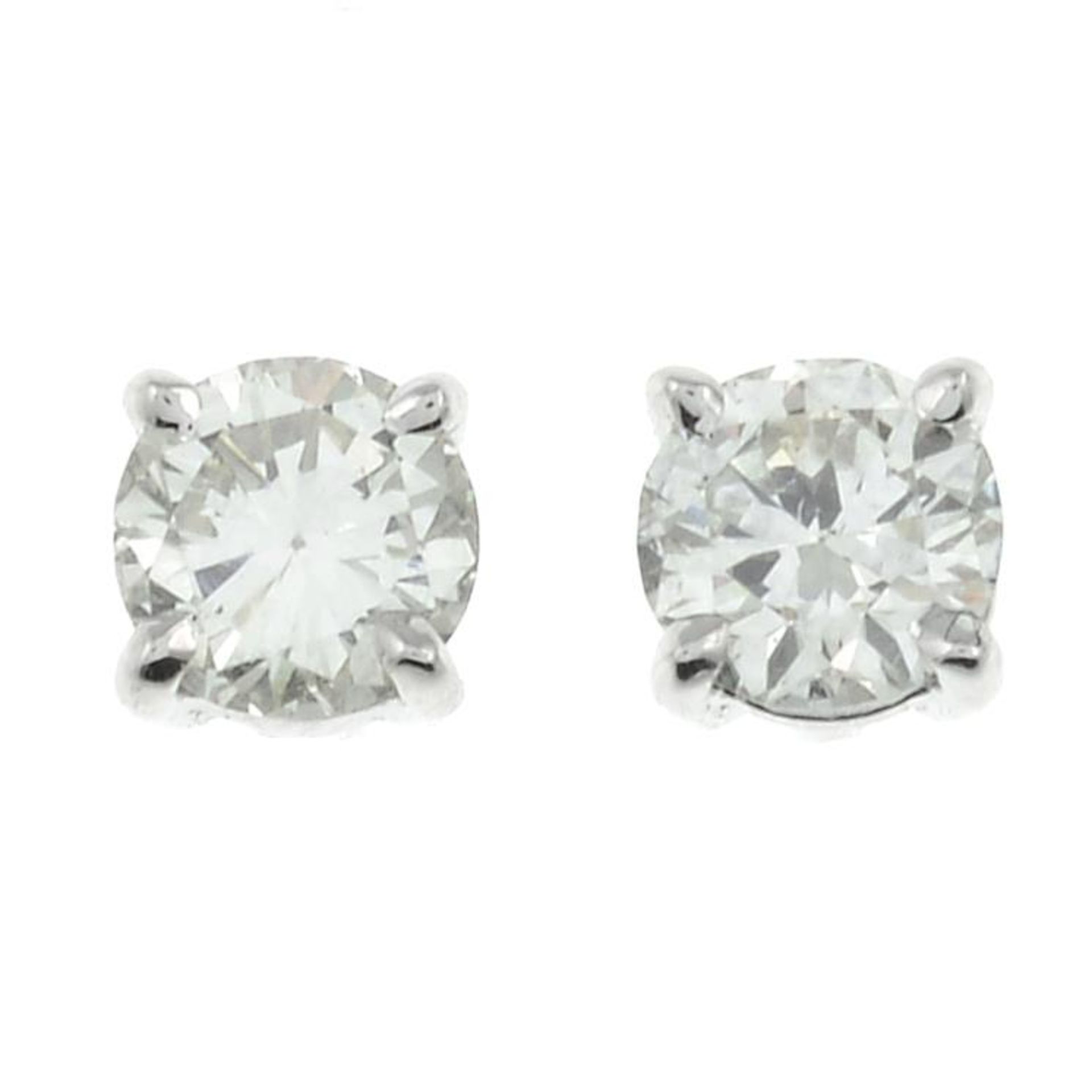 A pair of 18ct gold diamond stud earrings.Estimated total diamond weight 0.50ct,