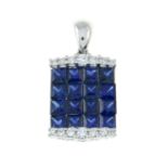 A sapphire and diamond pendant.Total sapphire weight 1.17cts,