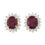 A pair of ruby and diamond cluster stud earrings.Estimated total diamond weight 0.30ct.