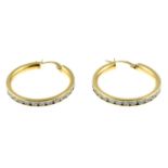 A pair of 9ct gold cubic zirconia hoop earrings.Hallmarks for 9ct gold.