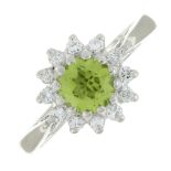 An 18ct gold peridot and diamond cluster ring.Estimated total diamond weight 0.25ct.