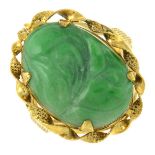 A carved jade single-stone ring.Ring size M.