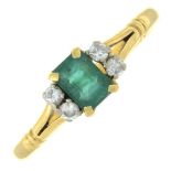 An emerald and diamond dress ring.Estimated total diamond weight 0.10ct.