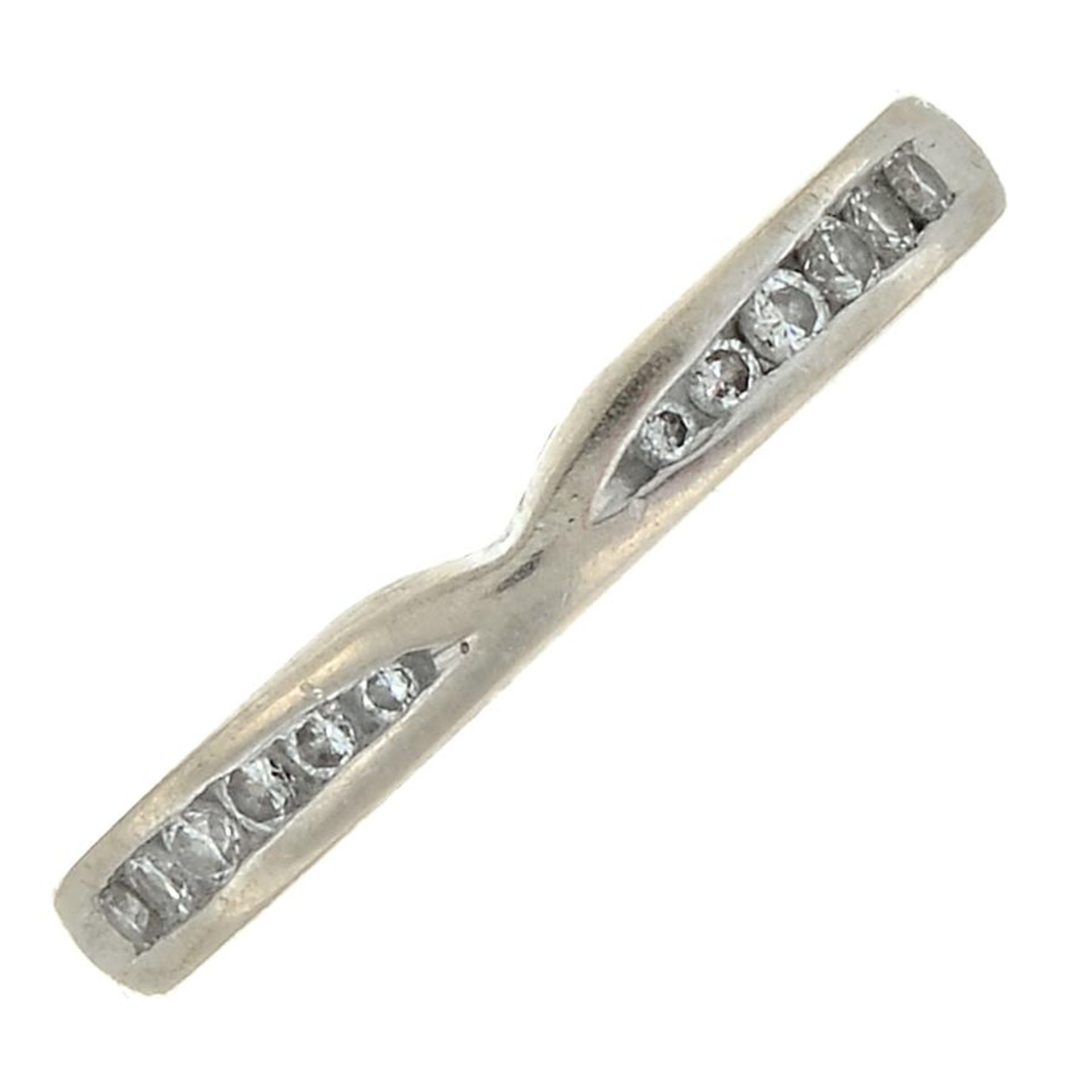 An 18ct gold diamond band ring.Estimated total diamond weight 0.15ct.