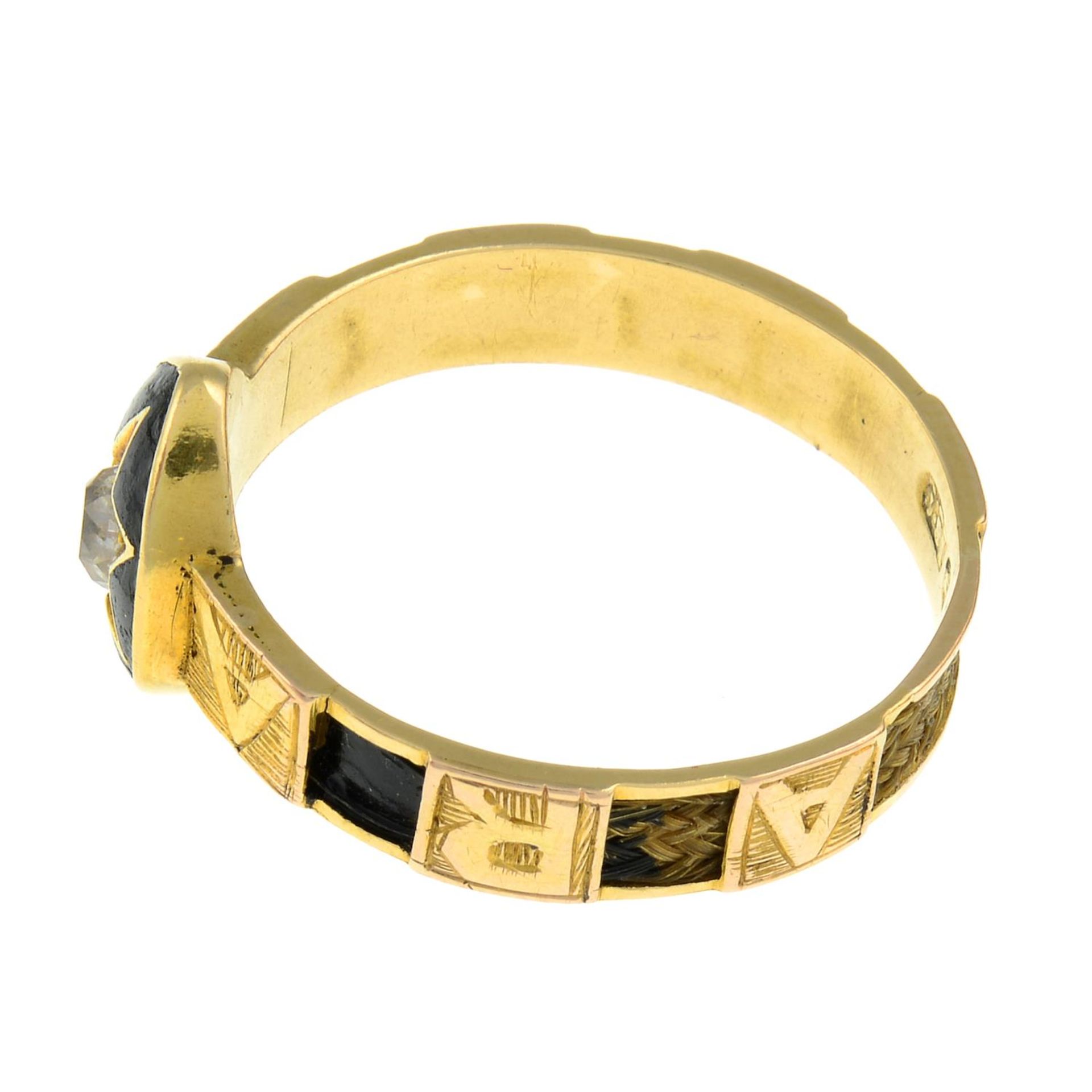 A late 19th century 18ct gold diamond and black enamel mourning ring, with hairwork accent band. - Bild 2 aus 3