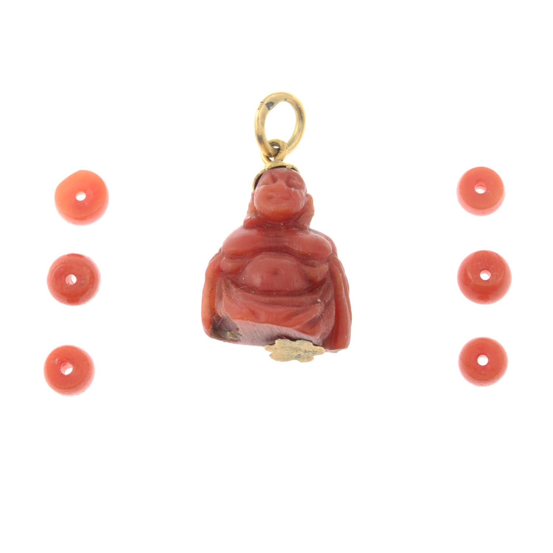 A coral Buddha pendant and a selection coral beads.Length of pendant 2.3cms.