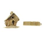 9ct gold house charm with garnet highlight,