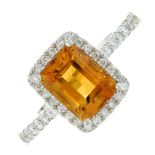 An 18ct gold citrine and diamond cluster ring.Citrine weight 1.62cts.