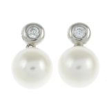 A pair of cultured pearl and diamond earrings.Total diamond weight 0.10ct, stamped to mount.