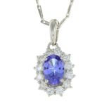 An 18ct gold tanzanite and diamond pendant,