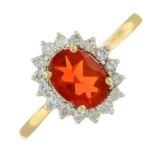 A 14ct gold diamond and red gem cluster ring.Estimated total diamond weight 0.30ct.