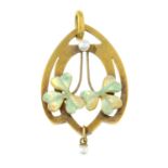 An Art Nouveau15ct gold seed pearl and enamel openwork pendant.Stamped 625.