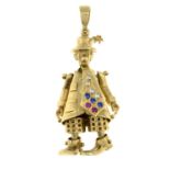 A 9ct gold paste articulated clown pendant.Hallmarks for Sheffield.Length 5.5cms.