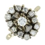 A diamond cluster ring.Estimated total diamond weight 0.80ct,