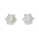 A pair of diamond cluster earrings.Estimated total diamond weight 0.15ct.