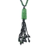 A carved dyed jade and onyx necklace.Length of pendant drop 12.5cms.