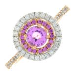 An 18ct gold pink sapphire and diamond cluster ring.Total diamond weight 0.26ct.