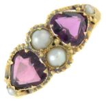 An early 20th century gold garnet and split pearl dress ring,