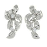 A pair of brilliant-cut diamond foliate stud earrings.Estimated total diamond weight 0.10ct.Stamped